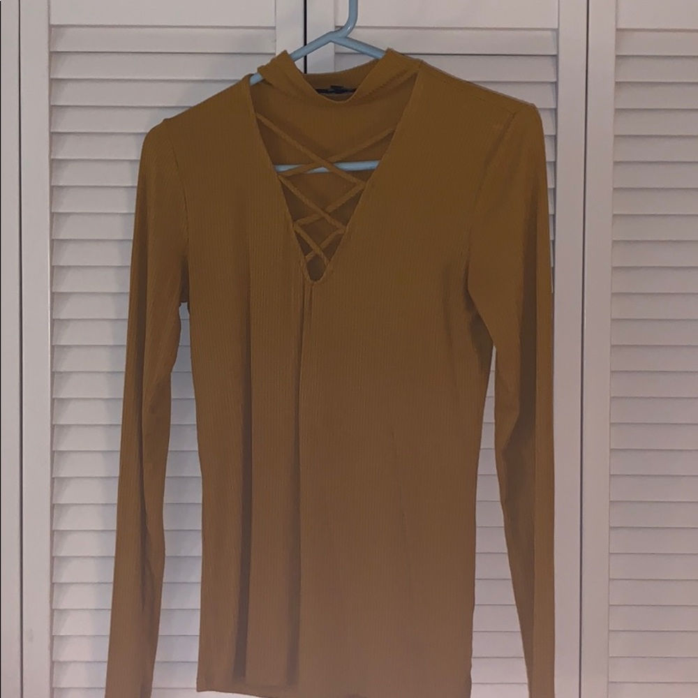 Gold long sleeve top with lace up detail